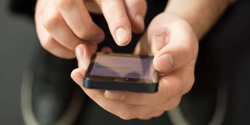 person reading text on a cell phone